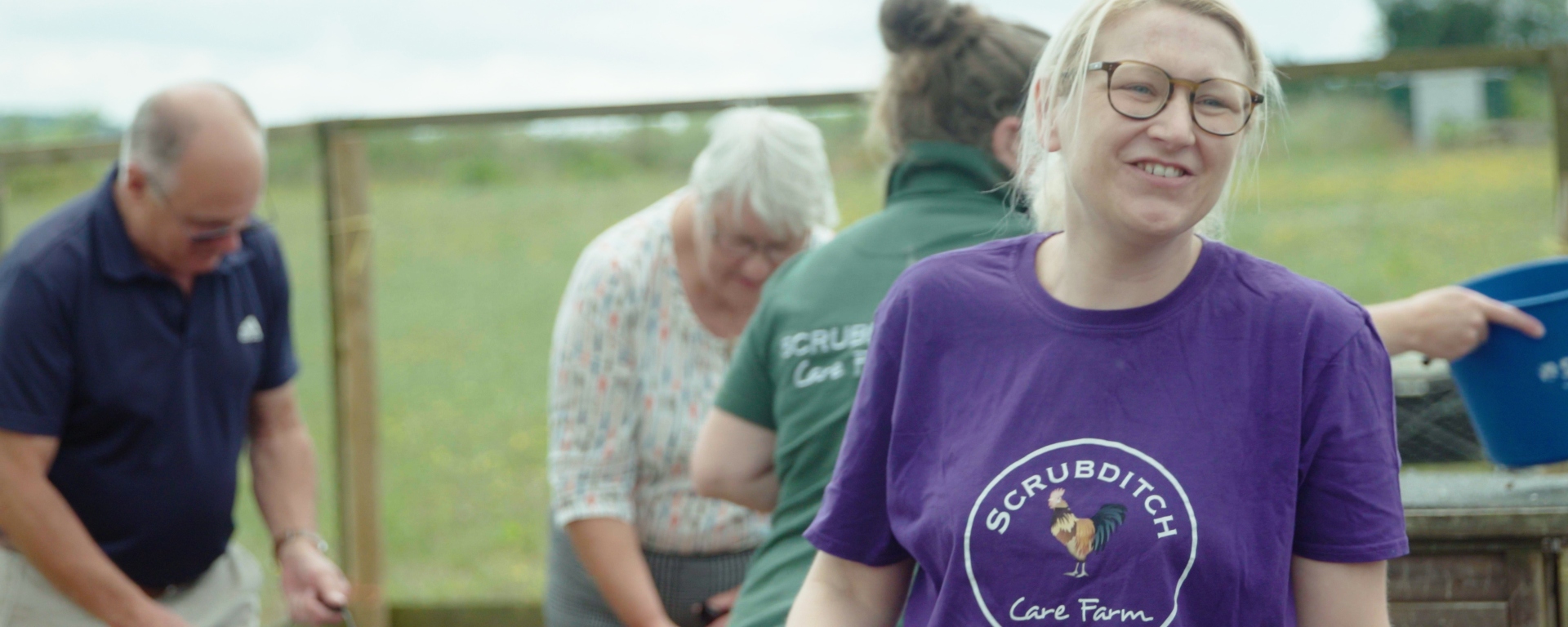 People smiling at a care farm